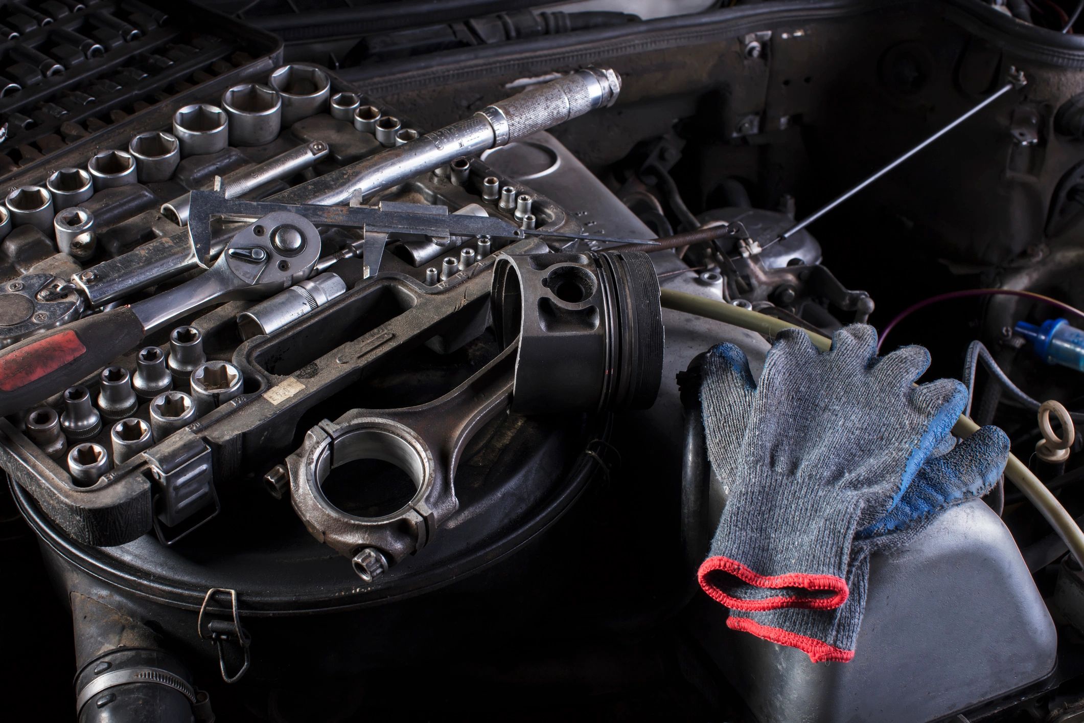 Close-up of engine components and tools during service