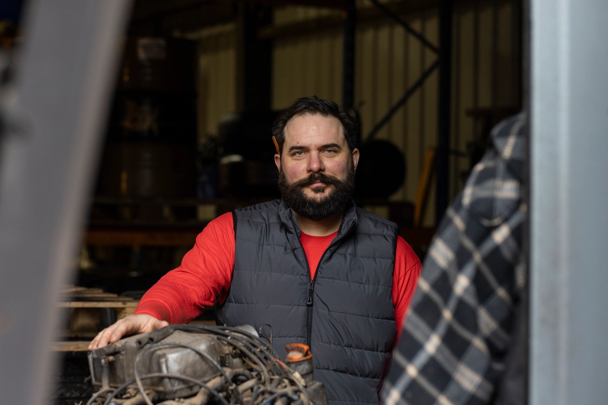 Mechanic working on an engine in a repair shop